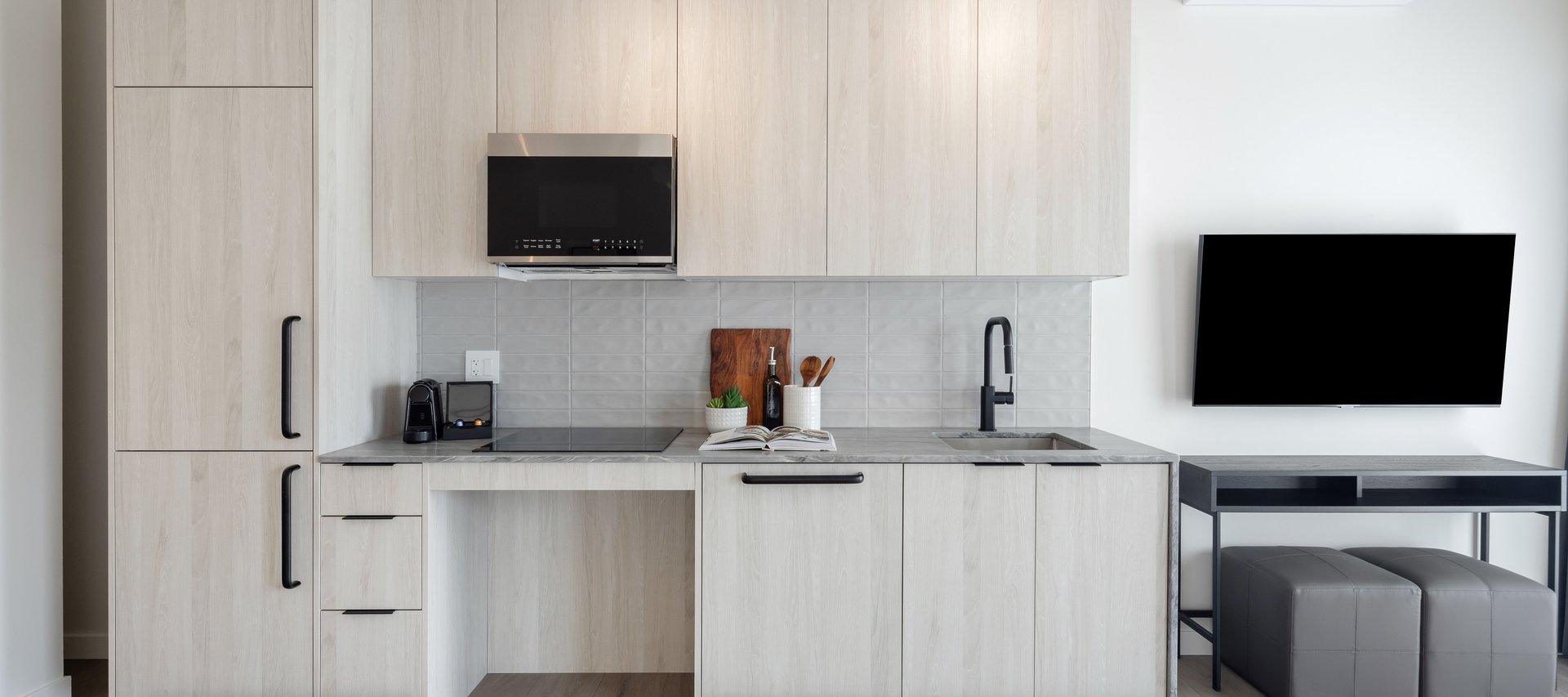 modern full kitchen with premium appliances of accessible waterfront studio at steveston waterfront hotel