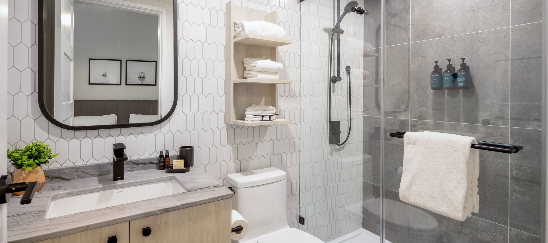 steveston waterfront hotel studio suite luxury bathroom features hand locally made bathroom amenities from fern and petal and standing shower