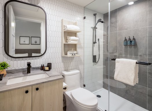 steveston waterfront hotel studio suite luxury bathroom features hand locally made bathroom amenities from fern and petal and standing shower
